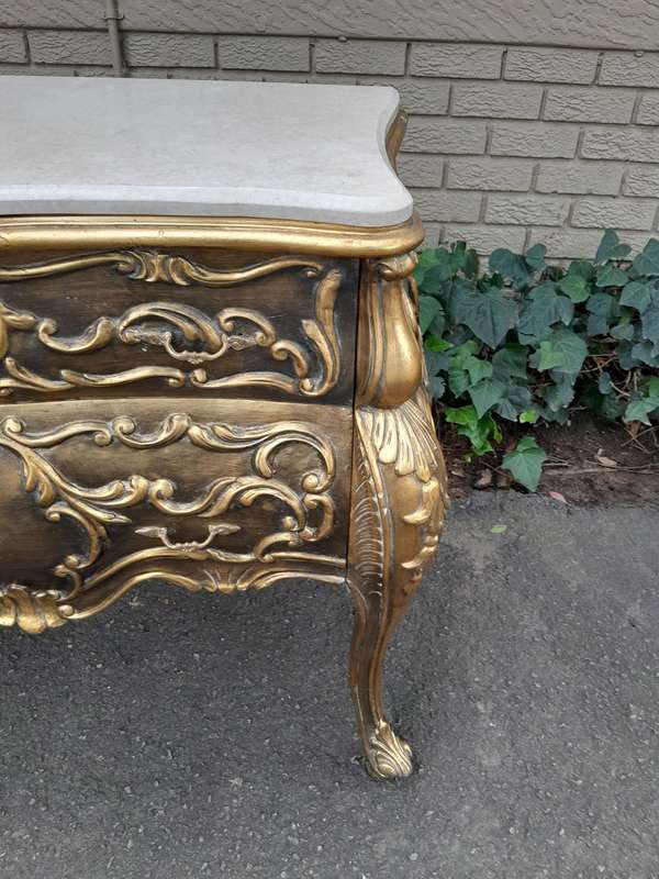 A Set of French Rococo Style Ornately Carved and Gilded Chest of Drawers and Pair of Side Tables ...