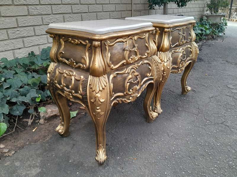 A Set of French Rococo Style Ornately Carved and Gilded Chest of Drawers and Pair of Side Tables ...
