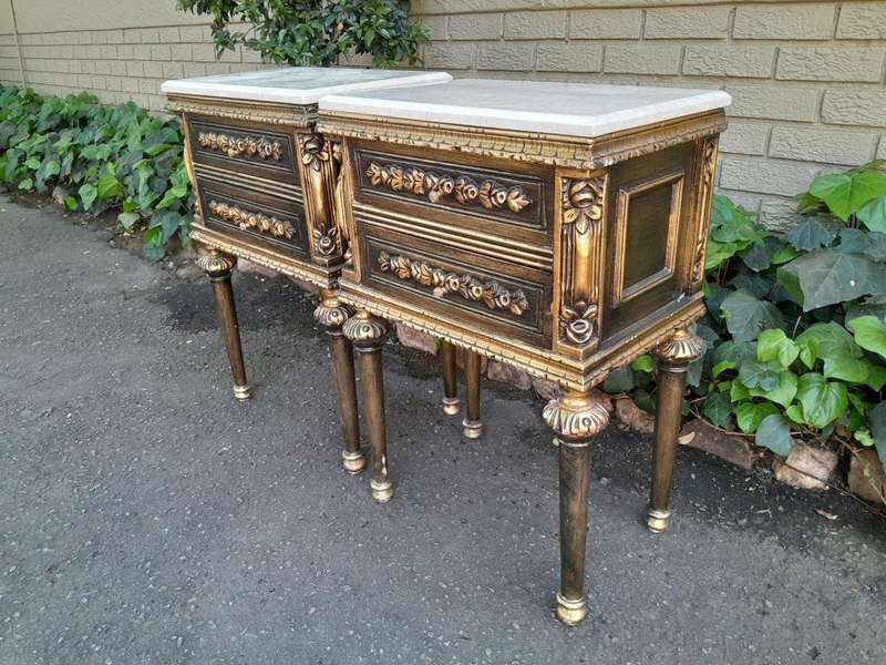 A Pair of French Style Ornately Carved Giltwood Pedestals/Side Tables with Cream Marble Tops