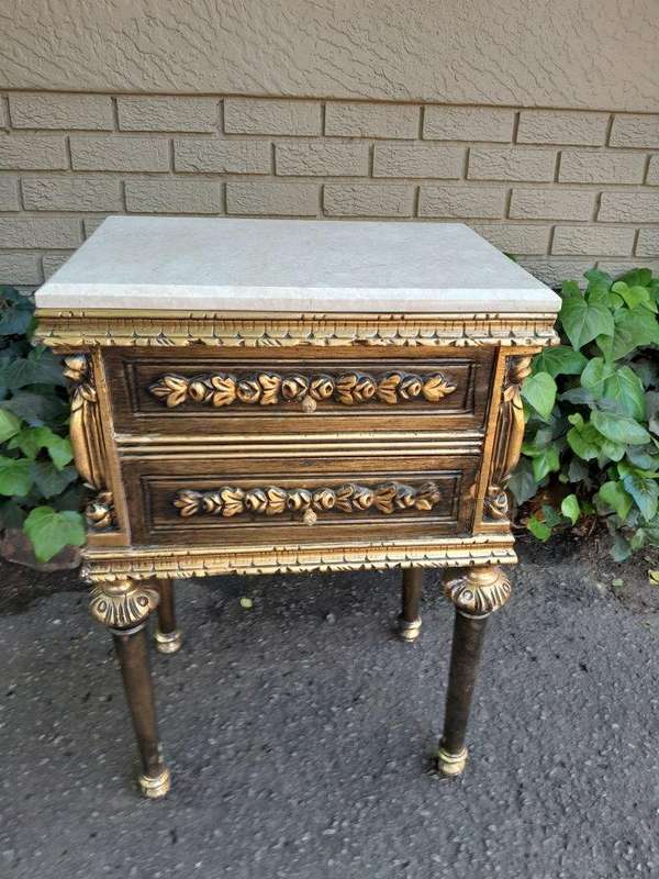 A Pair of French Style Ornately Carved Giltwood Pedestals/Side Tables with Cream Marble Tops