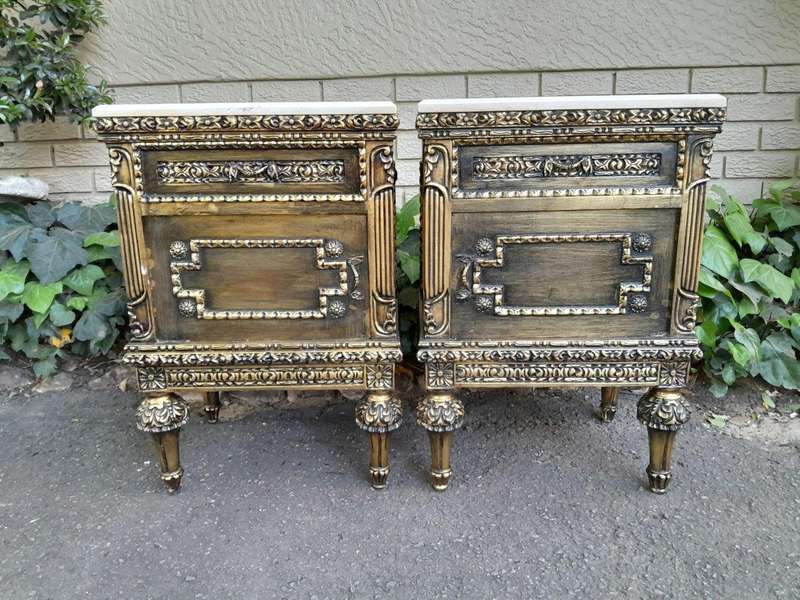 A Pair of French Style Ornately Carved Giltwood Pedestals/Side Tables with Cream Marble Tops