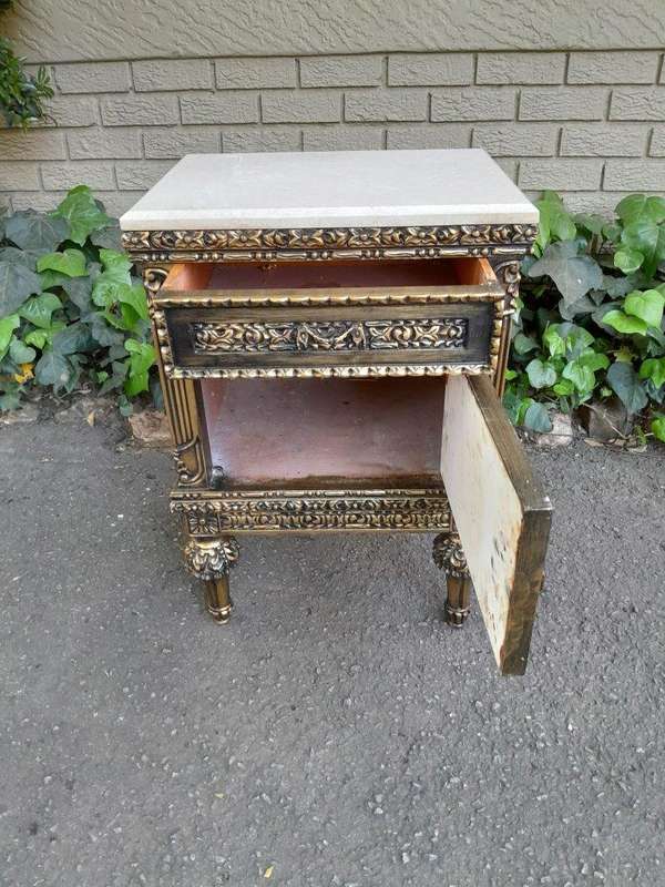 A Pair of French Style Ornately Carved Giltwood Pedestals/Side Tables with Cream Marble Tops