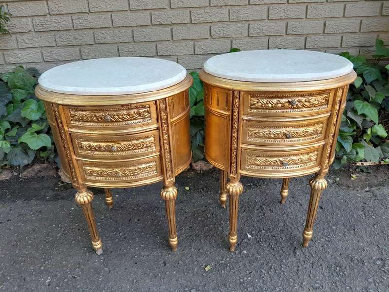 A Pair of French Style Hand-Gilded Oval Pedestals/Side Tables with Cream Marble Tops