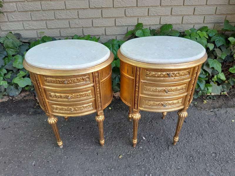 A Pair of French Style Hand-Gilded Oval Pedestals/Side Tables with Cream Marble Tops