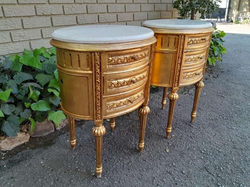 A Pair of French Style Hand-Gilded Oval Pedestals/Side Tables with Cream Marble Tops