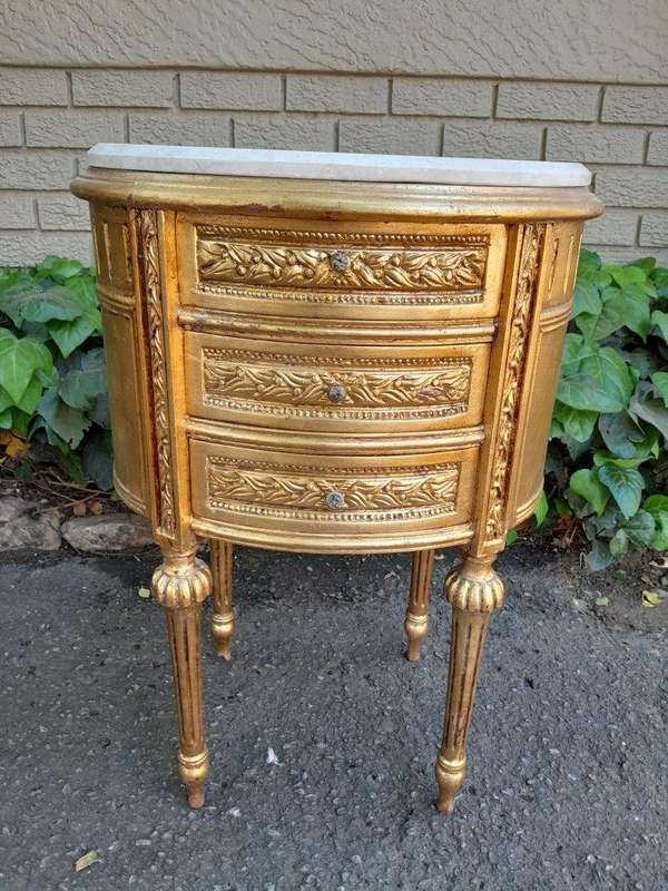 A Pair of French Style Hand-Gilded Oval Pedestals/Side Tables with Cream Marble Tops