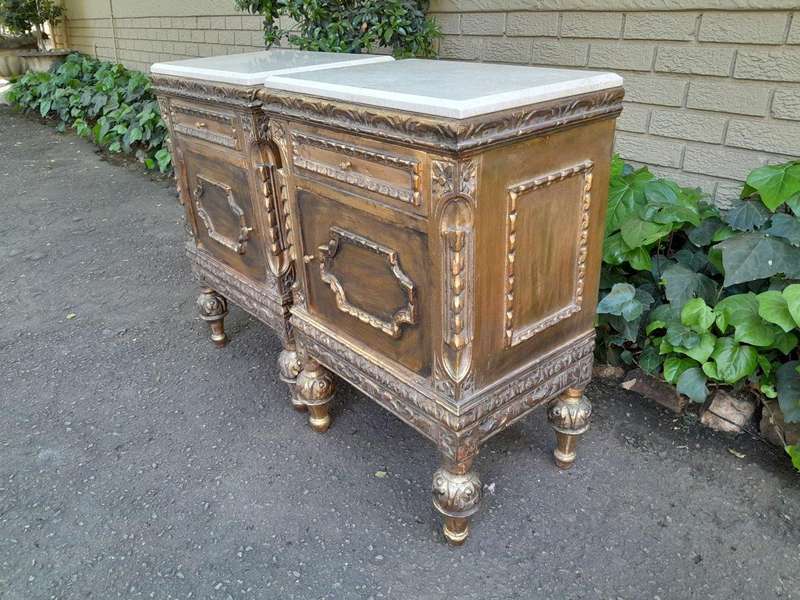 A Pair of French Style Ornately Carved Giltwood Pedestals/Side Tables with Marble Tops