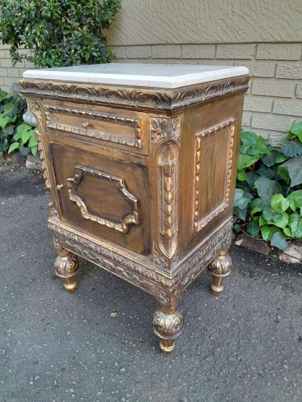 A Pair of French Style Ornately Carved Giltwood Pedestals/Side Tables with Marble Tops