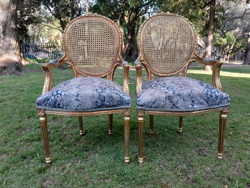 A Pair of 20th Century French Style Rattan-Back Gilded Arm Chairs