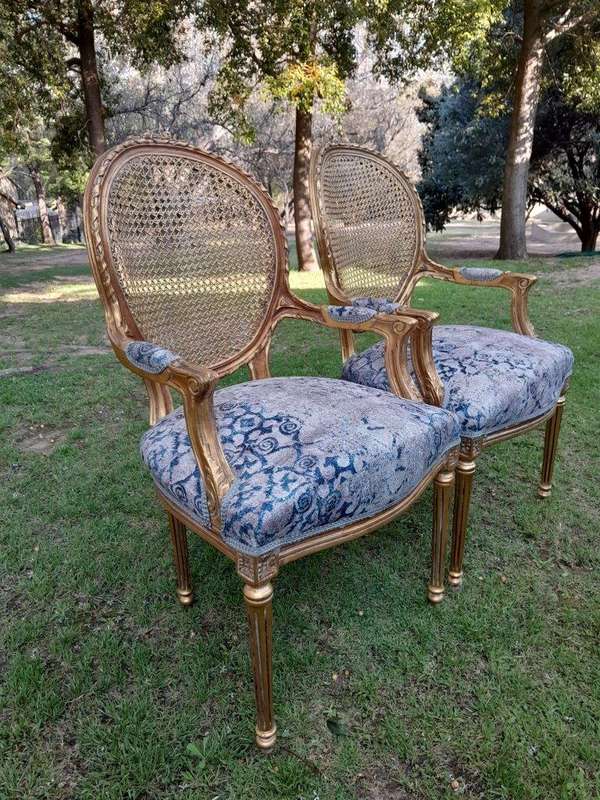 A Pair of 20th Century French Style Rattan-Back Gilded Arm Chairs