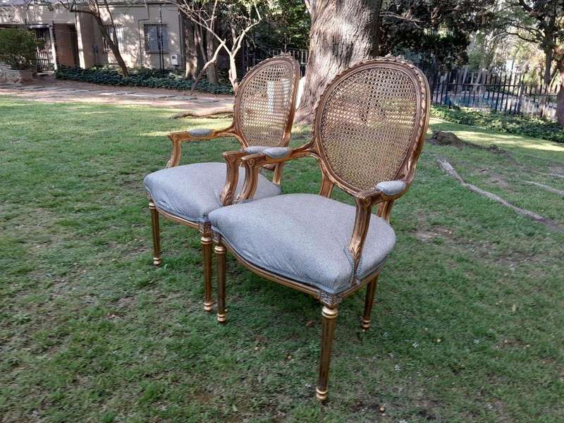 A Pair of 20th Century French Style Rattan-Back Gilded Arm Chairs