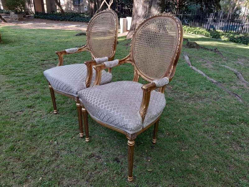 A Pair of 20th Century French Style Rattan-Back Gilded Arm Chairs