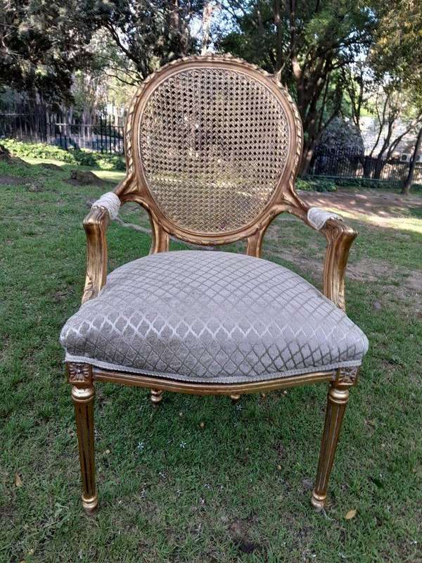 A Pair of 20th Century French Style Rattan-Back Gilded Arm Chairs
