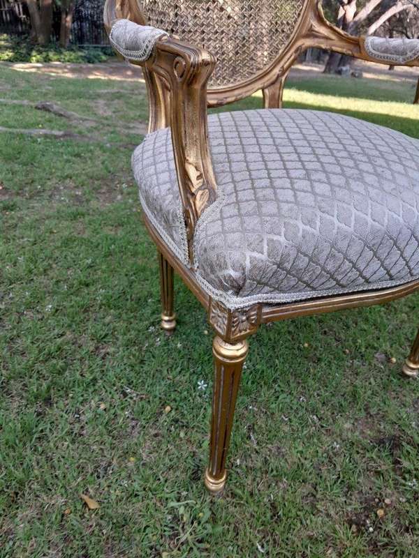 A Pair of 20th Century French Style Rattan-Back Gilded Arm Chairs