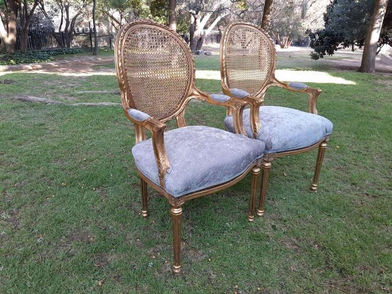 A Pair of 20th Century French Style Rattan-Back Gilded Arm Chairs
