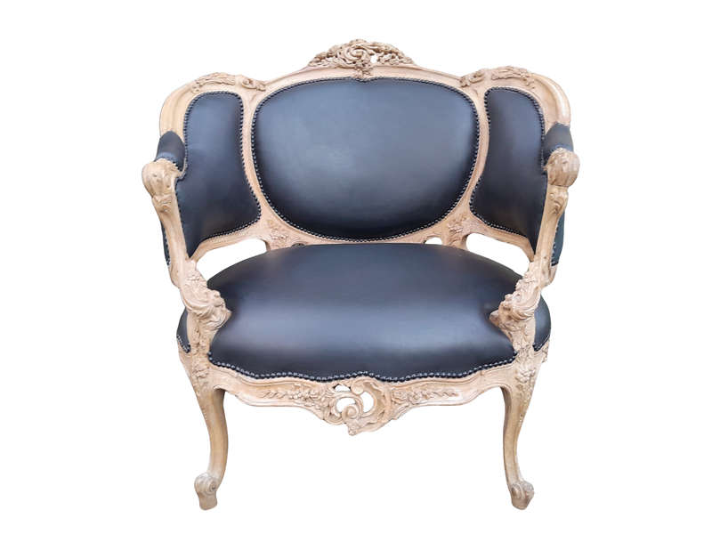 A 20TH Century French Style Bergere Style Carved Chair in a Contemporary Natural Wood Finish upho...