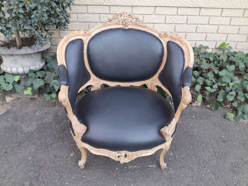 A 20TH Century French Style Bergere Style Carved Chair in a Contemporary Natural Wood Finish upho...