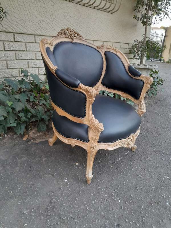 A 20TH Century French Style Bergere Style Carved Chair in a Contemporary Natural Wood Finish upho...