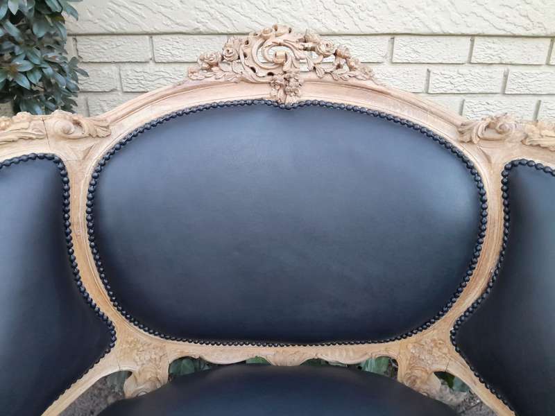 A 20TH Century French Style Bergere Style Carved Chair in a Contemporary Natural Wood Finish upho...