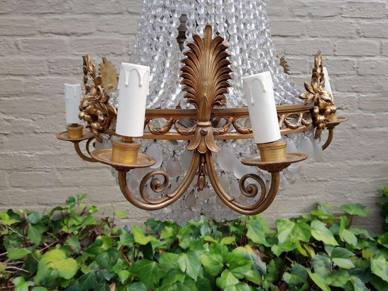 A 20th Century French Style Brass & Aged Chandelier