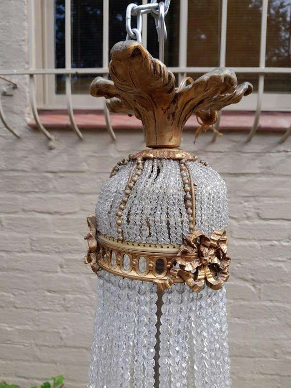 A 20th Century French Style Brass & Aged Chandelier
