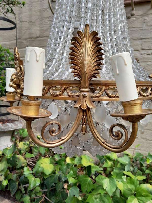 A 20th Century French Style Brass & Aged Chandelier