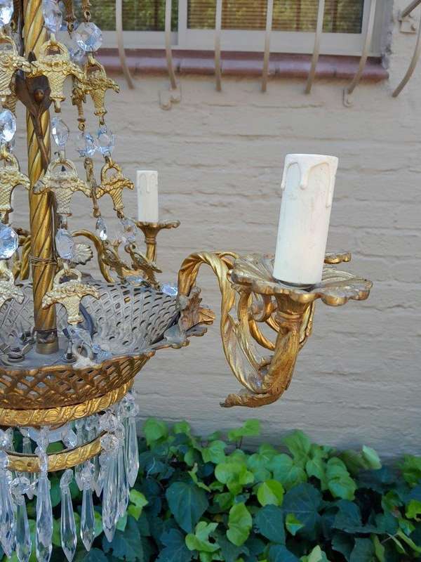 A 20th Century French Style Brass & Aged Crystal Chandelier