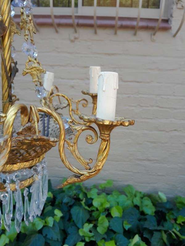 A 20th Century French Style Brass & Aged Crystal Chandelier