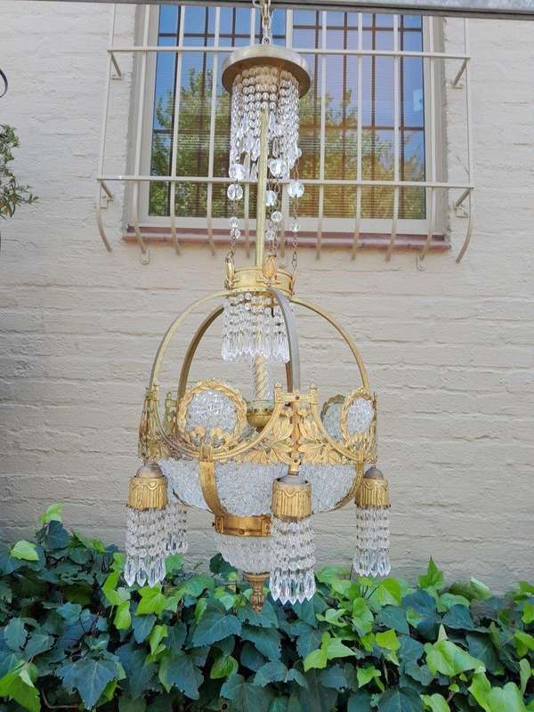 A 20th Century French Style Brass & Aged Crystal Chandelier