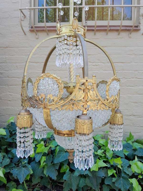 A 20th Century French Style Brass & Aged Crystal Chandelier
