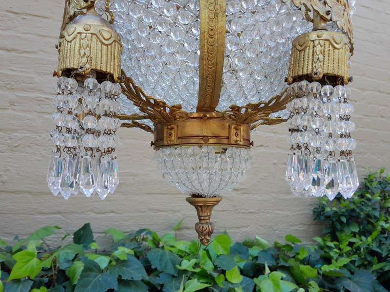 A 20th Century French Style Brass & Aged Crystal Chandelier