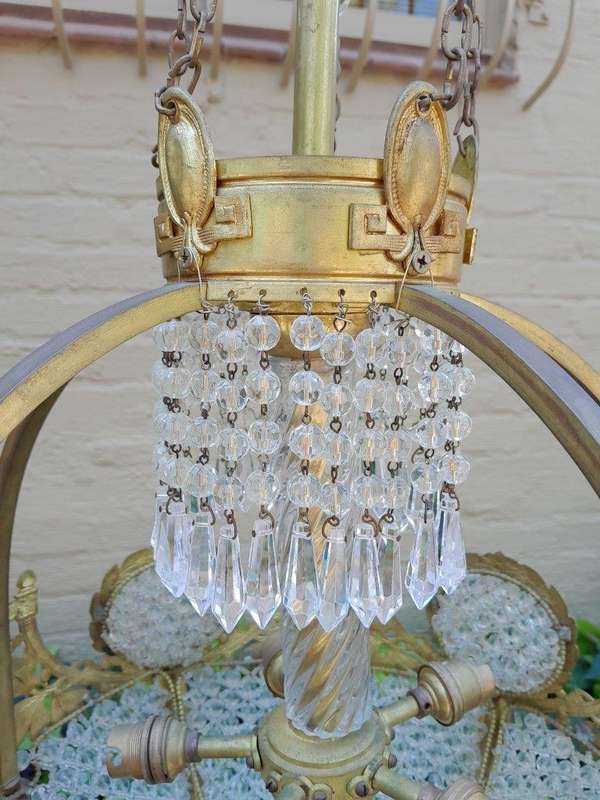 A 20th Century French Style Brass & Aged Crystal Chandelier