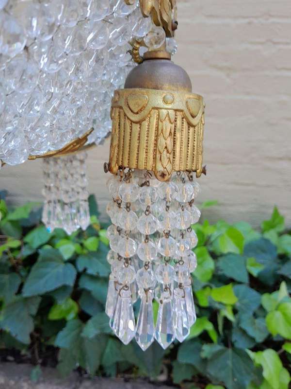 A 20th Century French Style Brass & Aged Crystal Chandelier