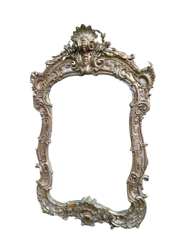 A French Rococo Style Ornately Carved and Gilded Bevelled Mirror