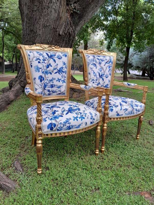 A Pair Of 20th Century French Louis XVI Styled Ornately Carved And Gilded Fautelli Chairs (variou...