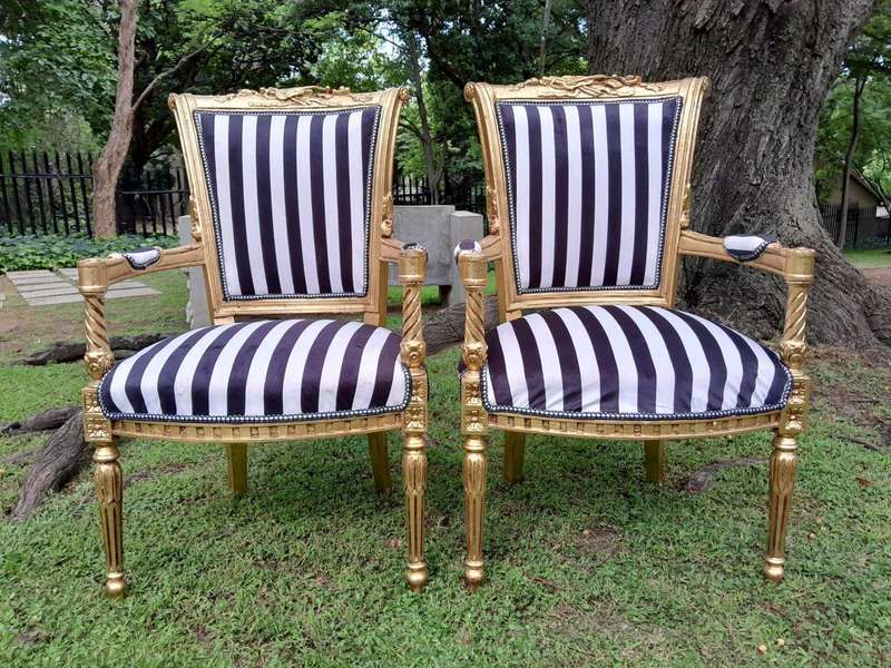 A Pair Of 20th Century French Louis XVI Styled Ornately Carved And Gilded Fautelli Chairs (variou...