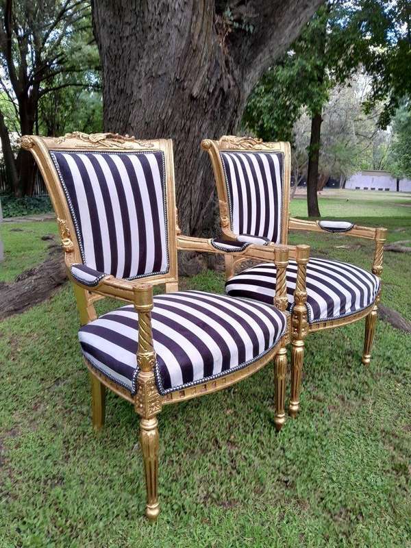 A Pair Of 20th Century French Louis XVI Styled Ornately Carved And Gilded Fautelli Chairs (variou...