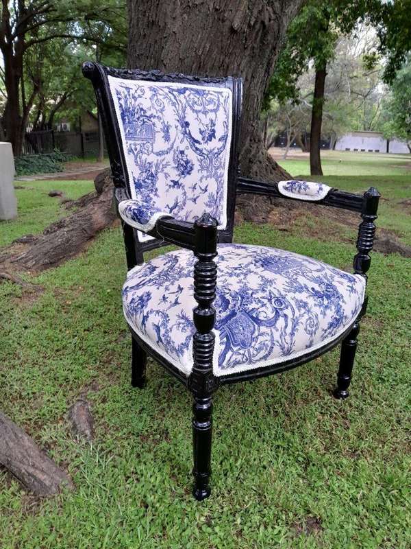 A Pair Of 20th Century French Louis XVI Styled Ornately Carved And Gilded Arm Chairs