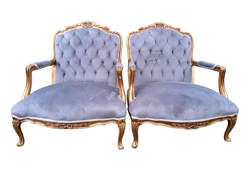 A French Style Pair Of Ornately Carved Gilt Wood Armchairs