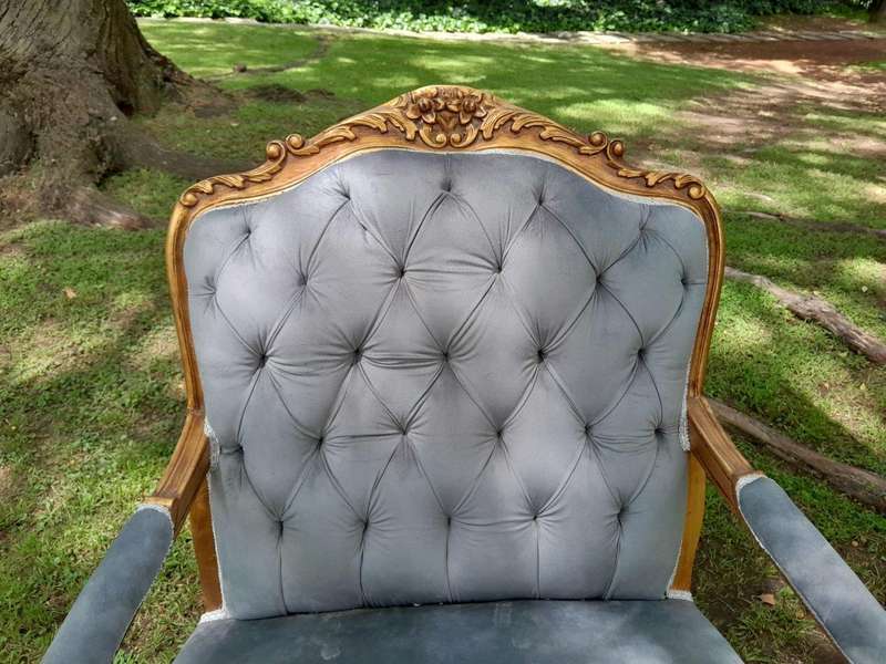 A French Style Pair Of Ornately Carved Gilt Wood Armchairs