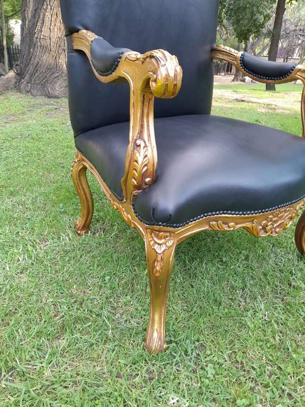 A 20TH Century Pair Of French Style Carved and Giltwood High Back Armchairs Upholstered in Leather