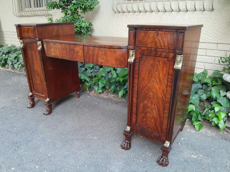 A George III Circa 1820 Mahogany / Flame Mahogany With Parcel Gild Sideboard With Two Cellarette ...