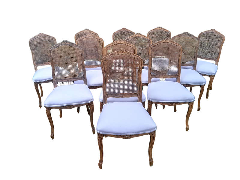 A Rare 20th Century Set Of Twelve French Colonial Style Walnut Rattan Dining Chairs