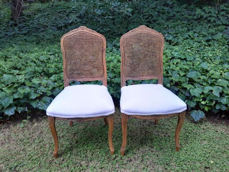 A Rare 20th Century Set Of Twelve French Colonial Style Walnut Rattan Dining Chairs