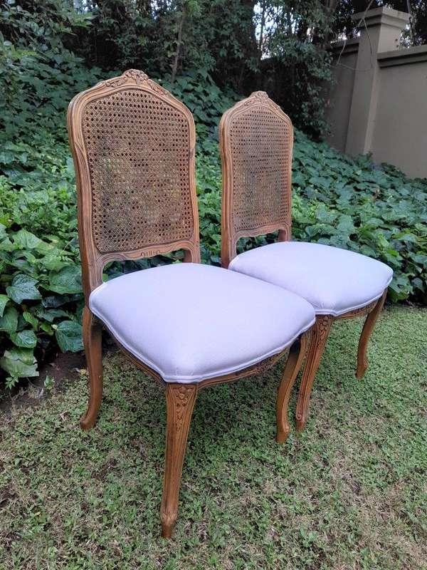 A Rare 20th Century Set Of Twelve French Colonial Style Walnut Rattan Dining Chairs