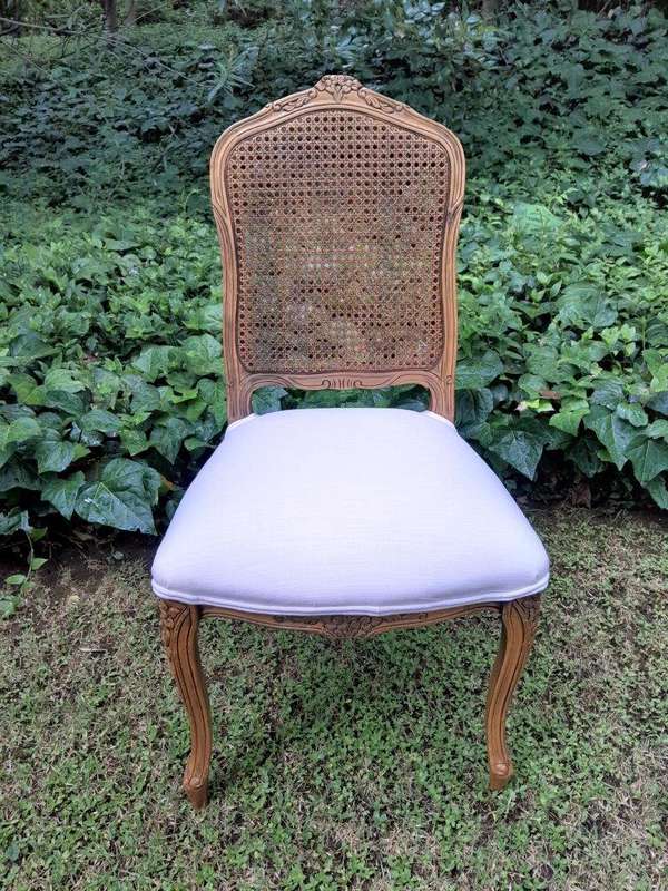 A Rare 20th Century Set Of Twelve French Colonial Style Walnut Rattan Dining Chairs