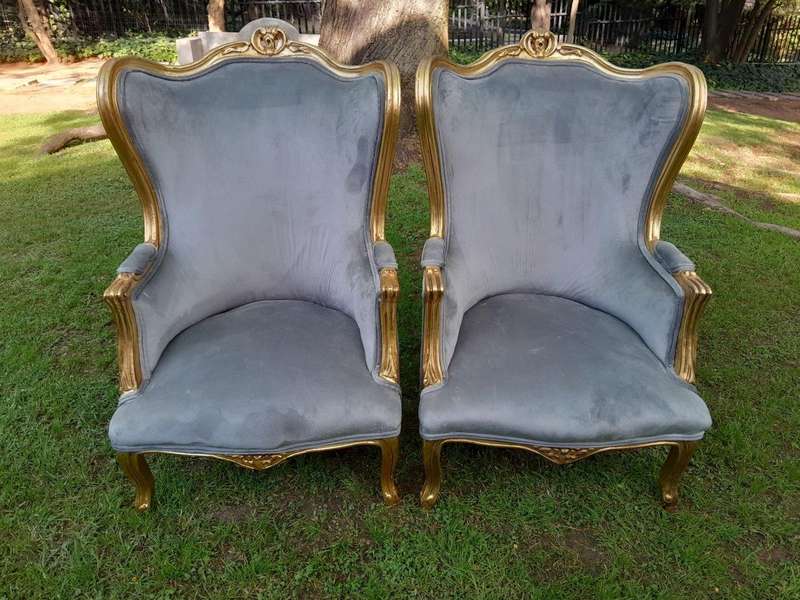 A Pair Of French Style Carved Wooden Wingback Armchairs