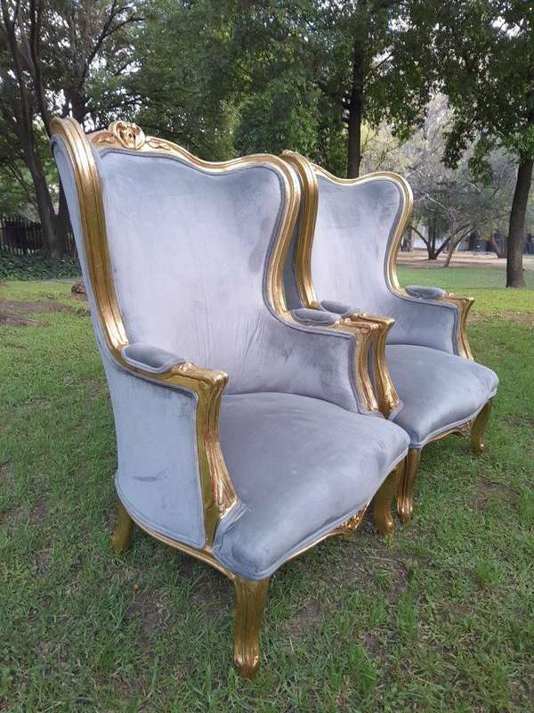 A Pair Of French Style Carved Wooden Wingback Armchairs
