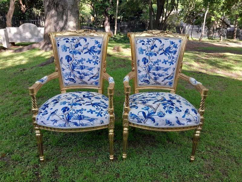 A Pair Of French Style Ornately Carved Wooden Armchairs