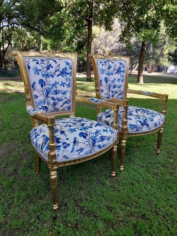 A Pair Of French Style Ornately Carved Wooden Armchairs